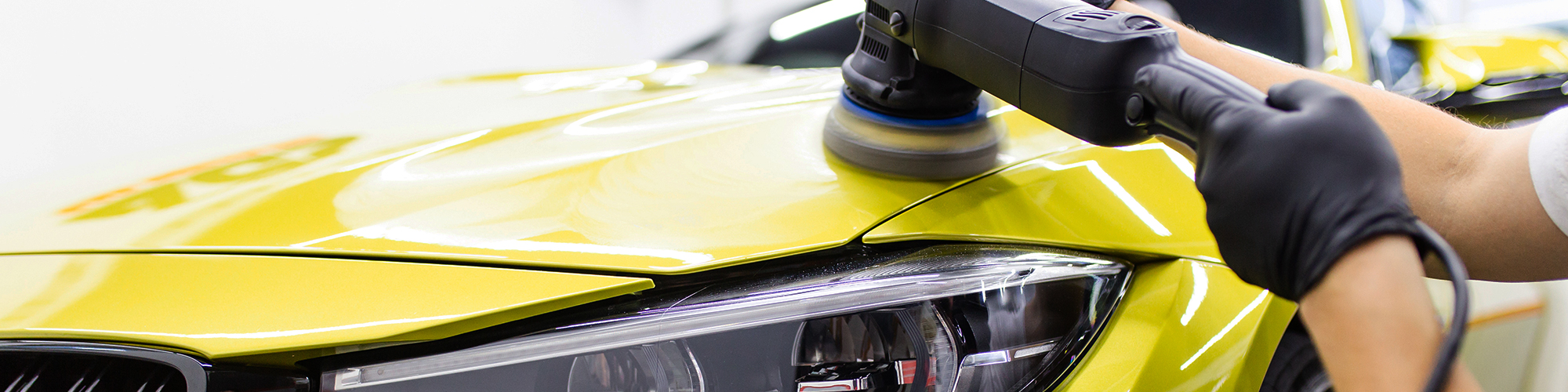Yellow Sports Car Being Polished